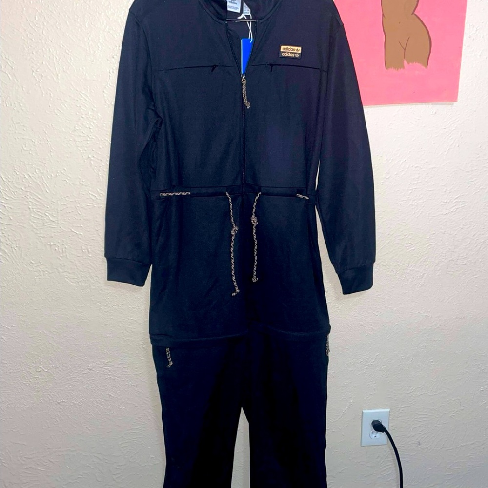 Lg adidas jump suit with detachable pants attachment.